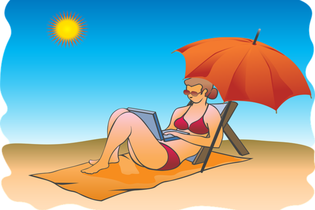 Woman on Beach working, laptop
